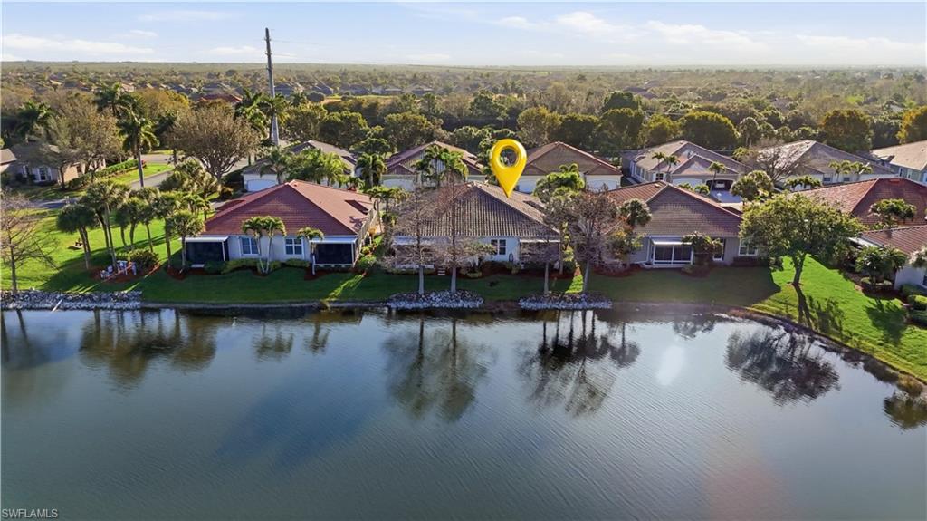 Aerial perspective of suburban area featuring a large body of water - Virtually Edited Image