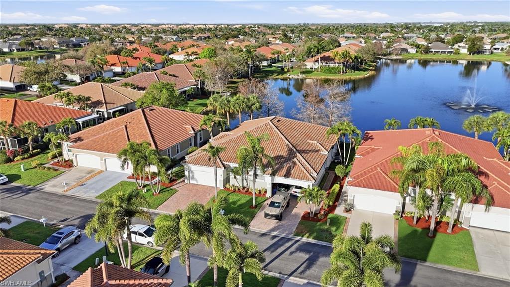 Aerial perspective of suburban area with a nearby body of water - Virtually Edited Image