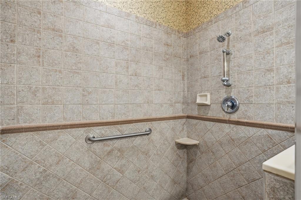 Bathroom featuring a tile shower - Virtually Edited Image
