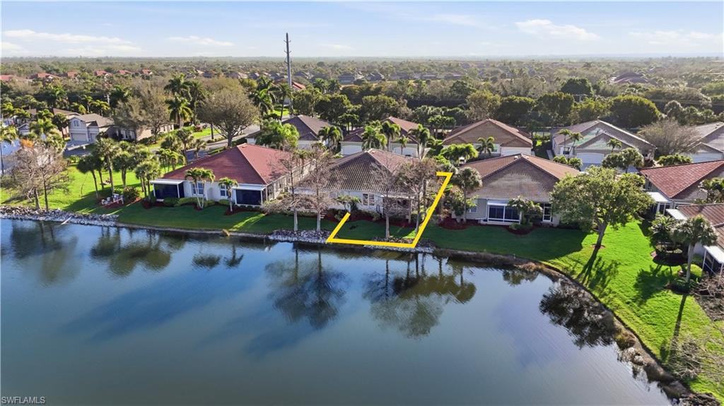 Aerial view of residential area with a large body of water - Virtually Edited Image