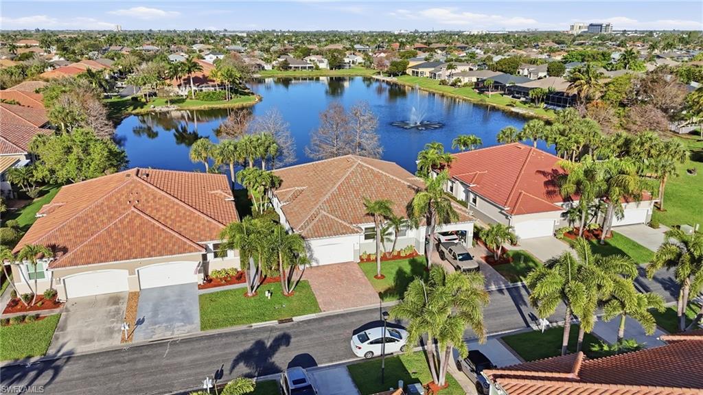 Aerial view of residential area with a large body of water - Virtually Edited Image
