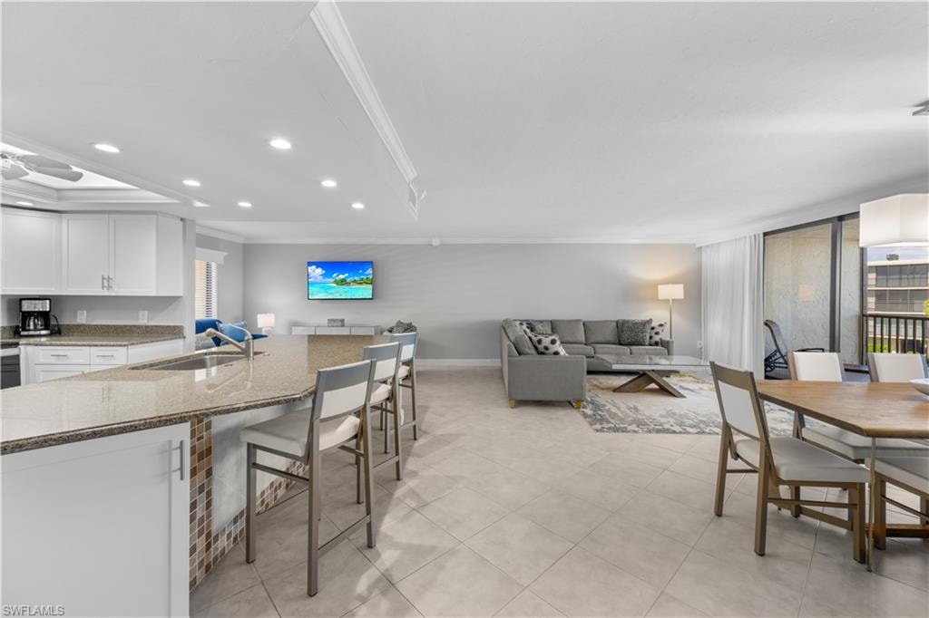 Living, dining, kitchen bar area.