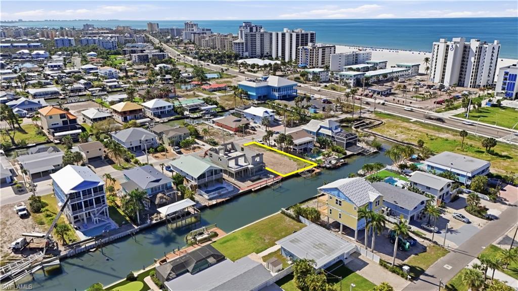 View of urban area featuring a nearby body of water - Virtually Edited Image