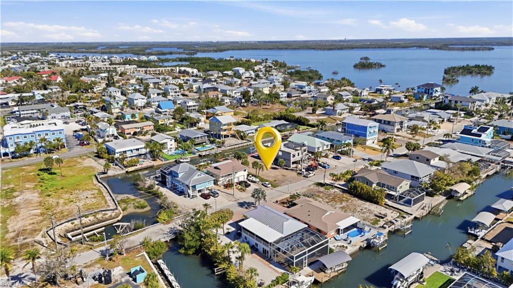 Aerial perspective of suburban area with a large body of water - Virtually Edited Image