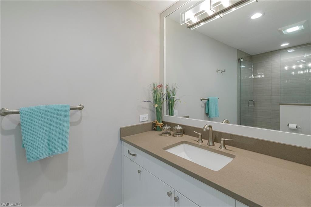 Bathroom with walk in shower and vanity