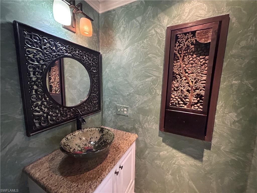 Half bathroom featuring vanity