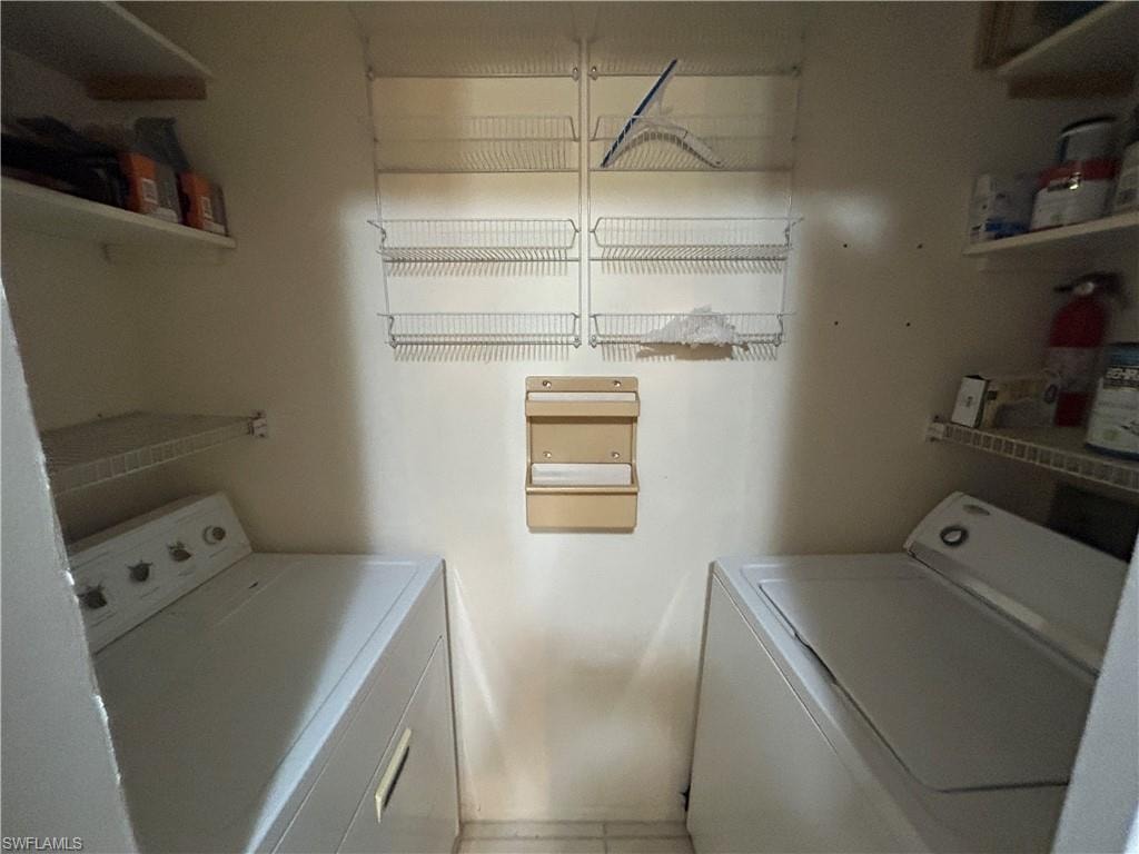 Laundry room with washing machine and clothes dryer