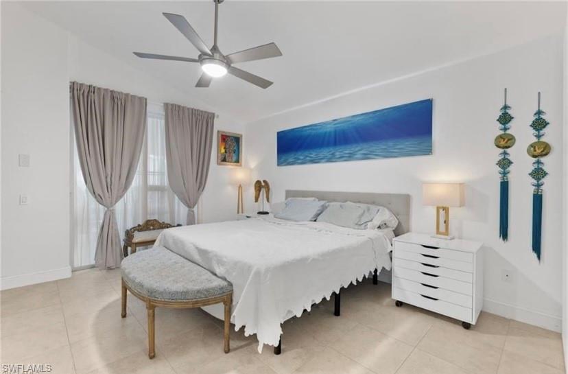 Bedroom with lofted ceiling and ceiling fan