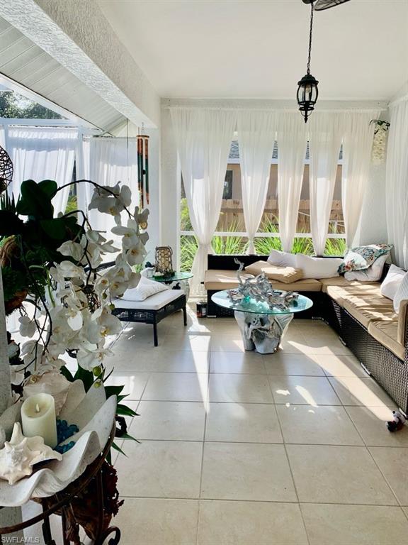 Sunroom / solarium with tile patterned floors