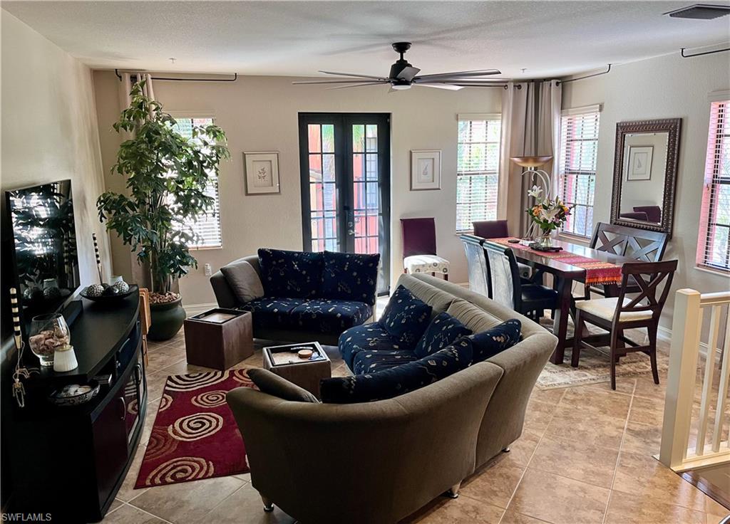 Great room with dining area, natural light and a julienne balcony overlooking the courtyard below.