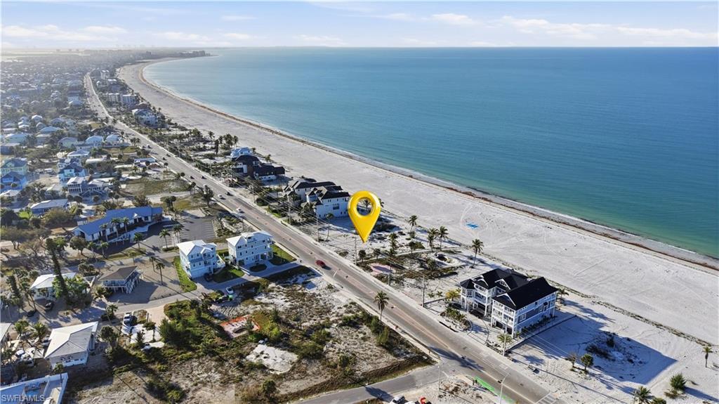 Aerial perspective of suburban area with expansive beach - Virtually Edited Image
