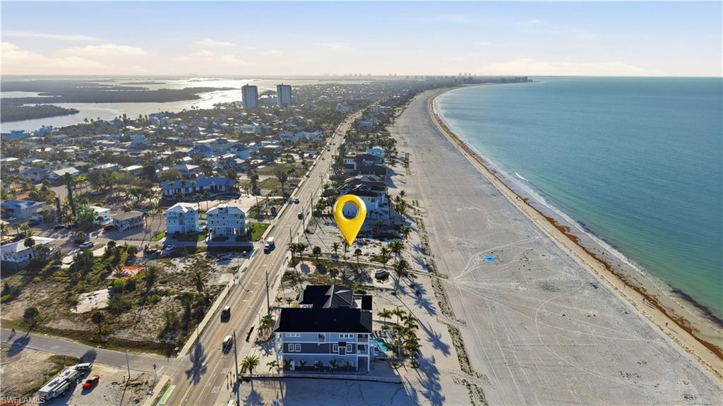 Aerial view of property and surrounding area with expansive coastline - Virtually Edited Image