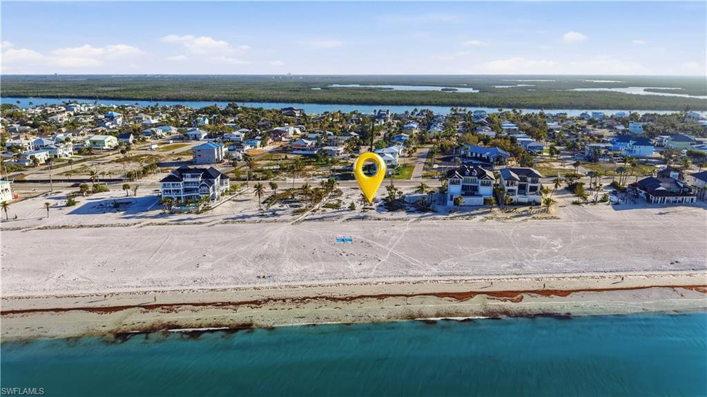 Aerial perspective of suburban area featuring a nearby body of water - Virtually Edited Image