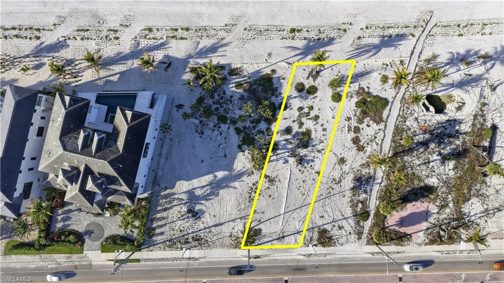 Aerial overview of property's location featuring property parcel outlined and a desert landscape - Virtually Edited Image