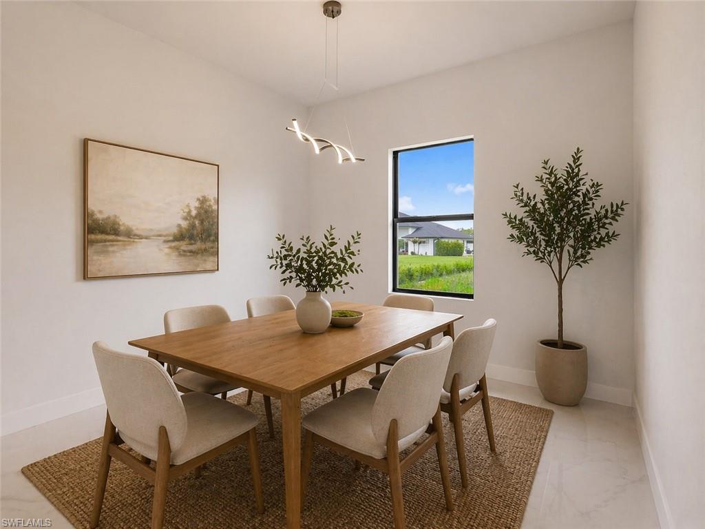 Dining area with a modern linear pendant light fixture, white tile flooring, and a large window
