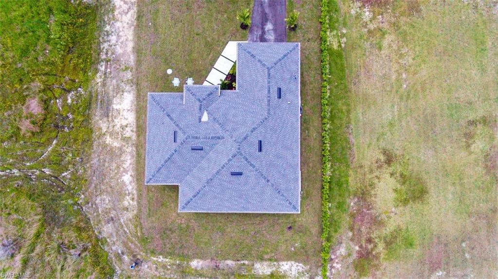 Gabled roofline property featuring a dark-toned asphalt shingle roof