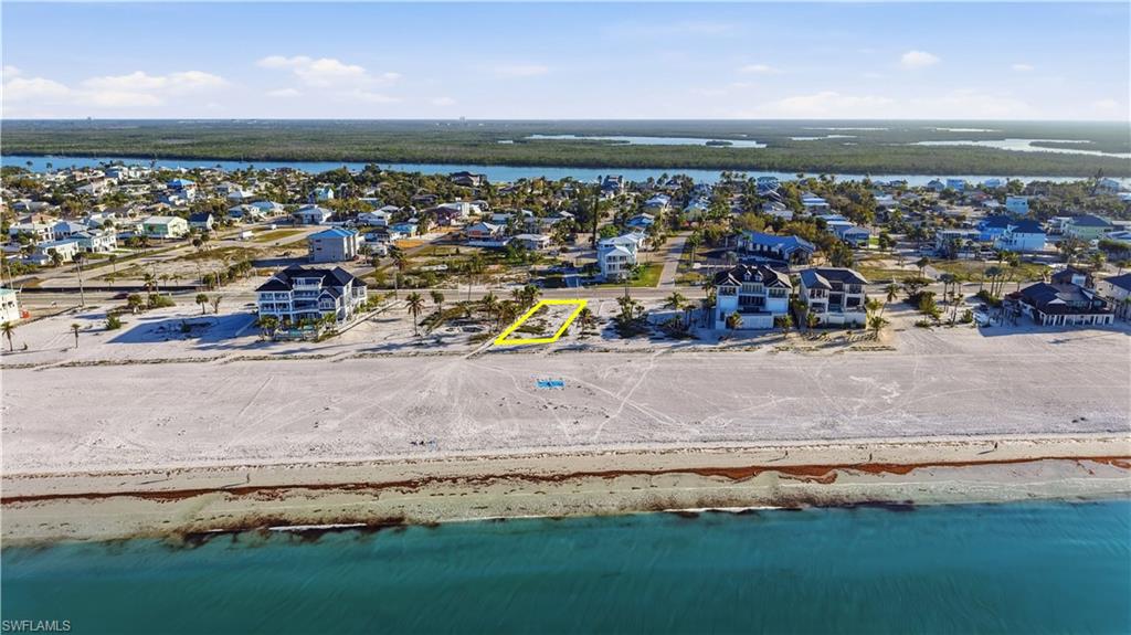 Aerial perspective of suburban area with a large body of water - Virtually Edited Image