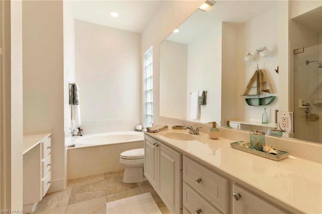 28100 Cetation Way Bonita Springs fL 34135 - Owner's bath one side with vanity area.