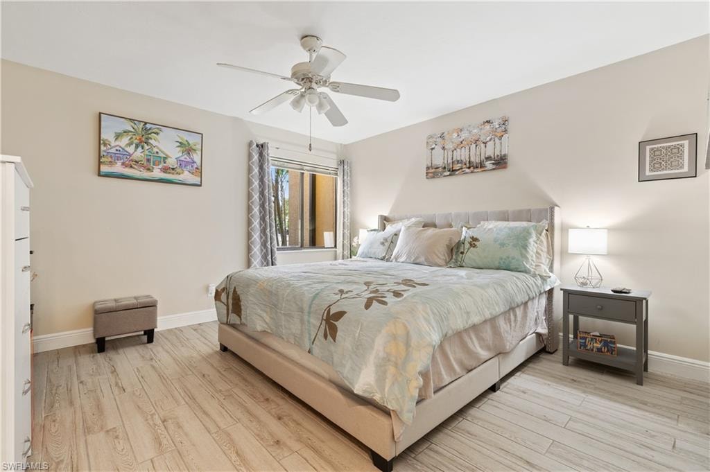 Bedroom featuring light wood-type flooring and a ceiling fan