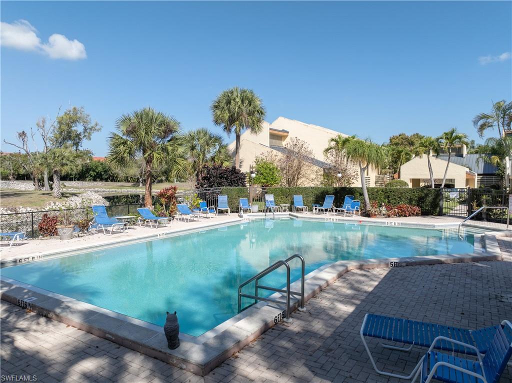 Community pool with a patio area