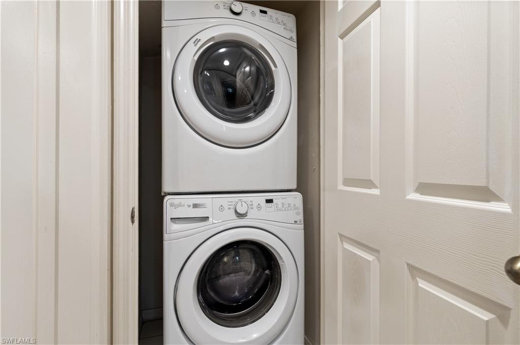 Laundry area featuring stacked washer / dryer