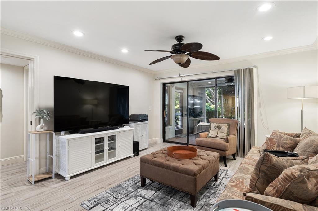 Living room featuring ceiling fan, light wood-type flooring, crown molding, and recessed lighting