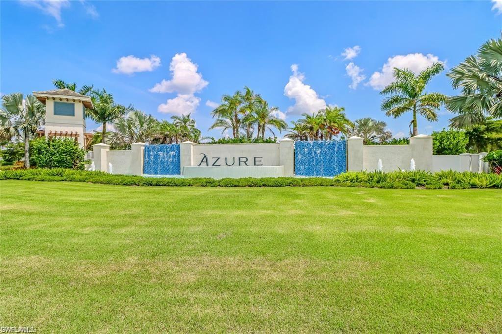 Community sign featuring a lawn