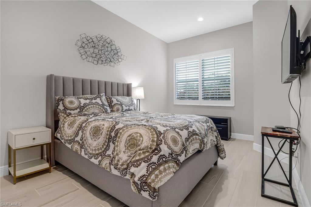 Bedroom featuring recessed lighting and baseboards
