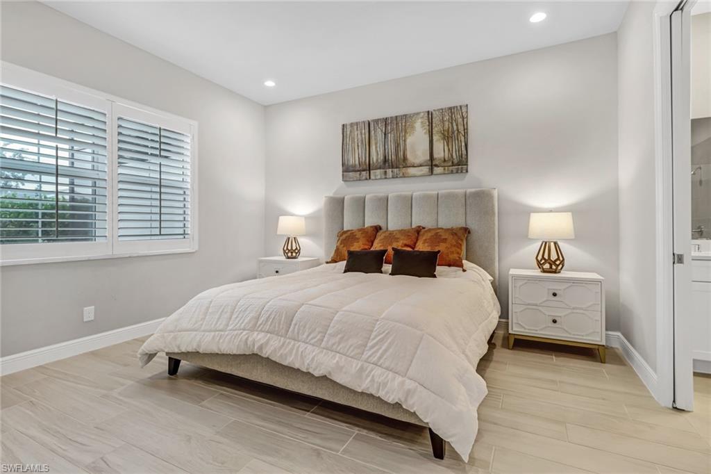 Bedroom featuring recessed lighting, baseboards, and wood tiled floor