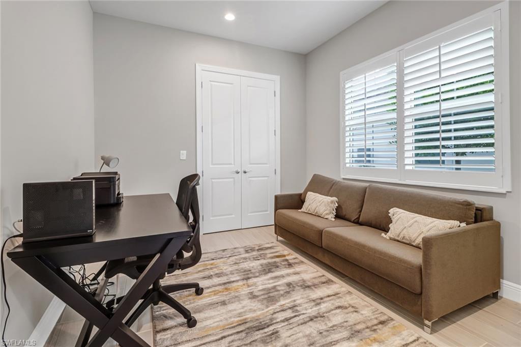 Office featuring recessed lighting, baseboards, and light wood-style floors