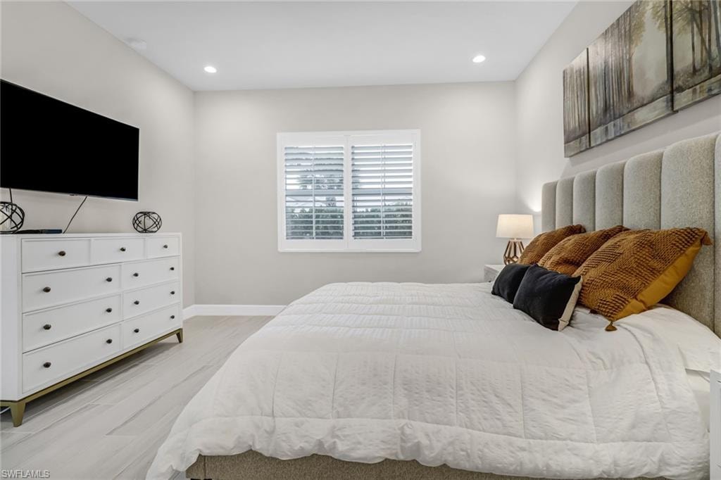 Bedroom with recessed lighting, baseboards, and light wood-style flooring