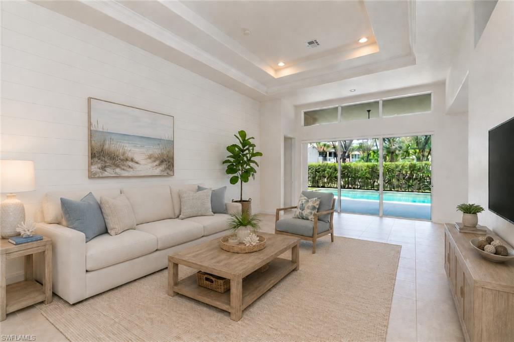 Photo shows home reimagined with walls painted white and updated furnishings.  AI GENERATED
