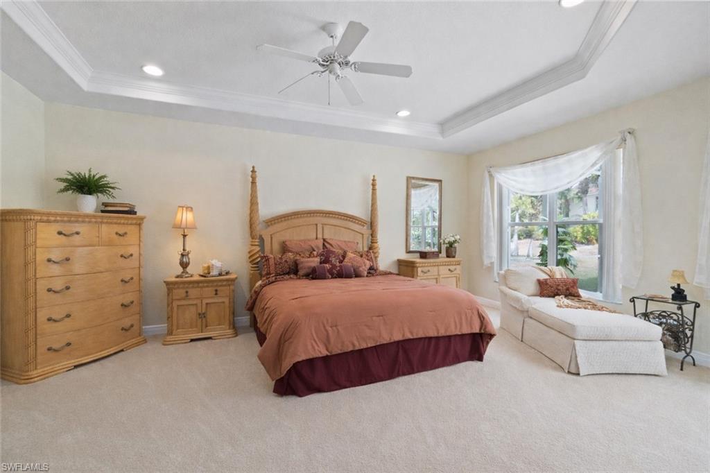Primary suite with high ceilings and tray ceiling