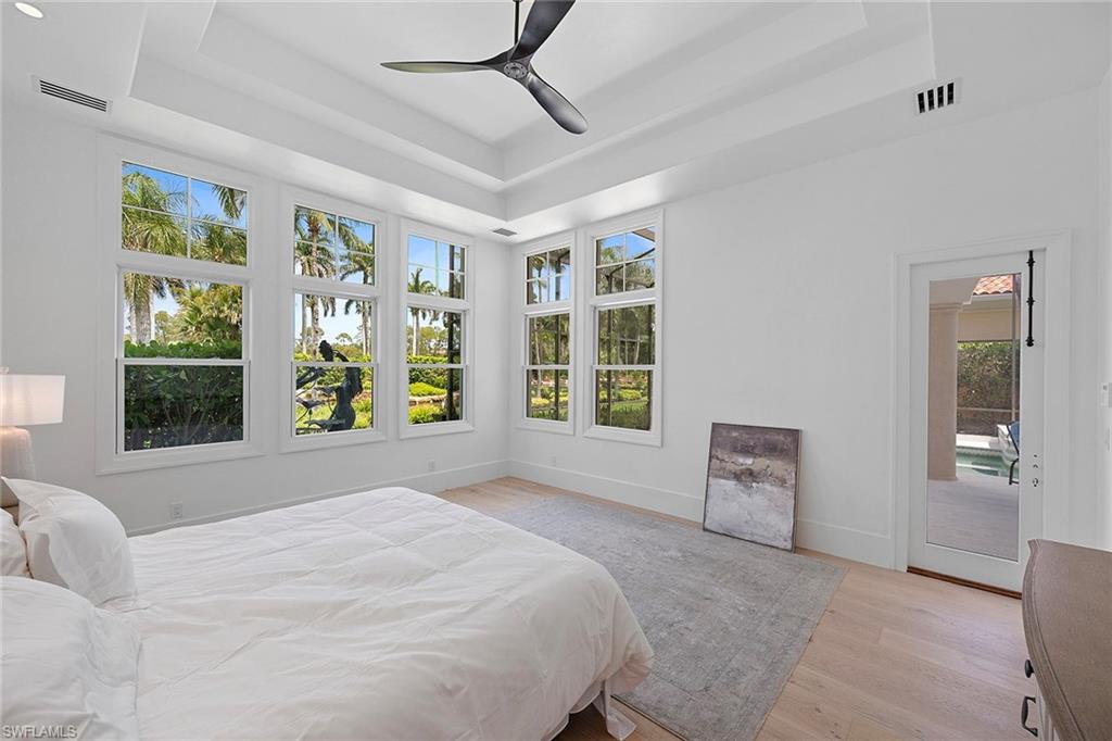 Primary Bedroom with door for pool access