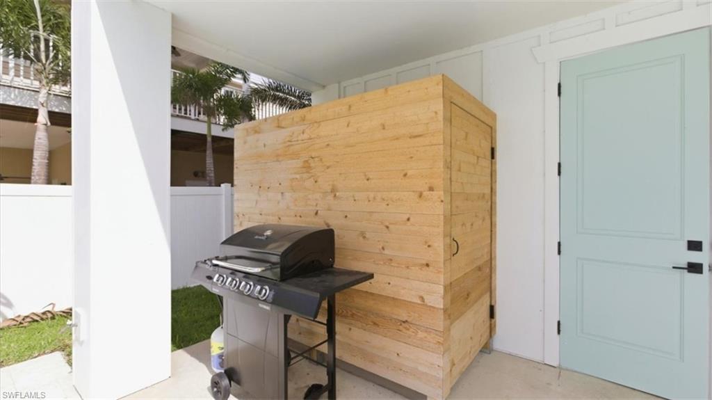 View of patio / terrace with grilling area and outdoor shower - Virtually Edited
