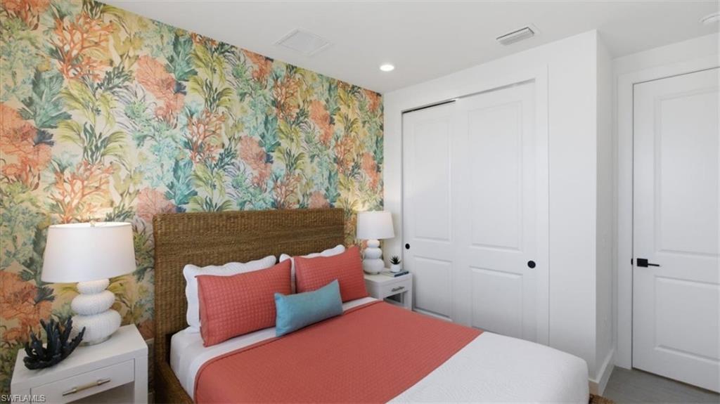 Bedroom featuring wallpapered walls, a closet, and recessed lighting - Virtually Edited