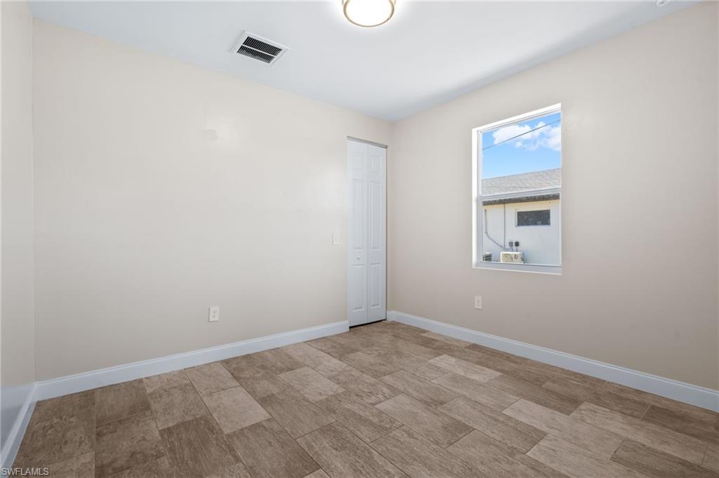Unfurnished room with baseboards