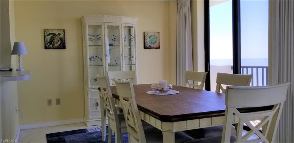 The dining room with kitchen pass thru seats 6 and gulf views from the juliette balcony.