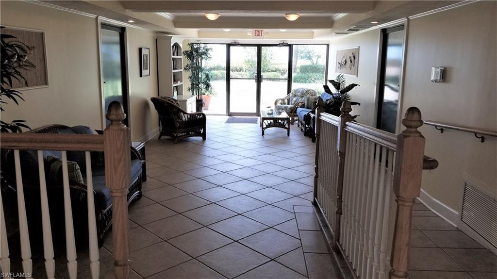 Entry lobby with elevator also provides doors to both garages and passage to the beach and pool.