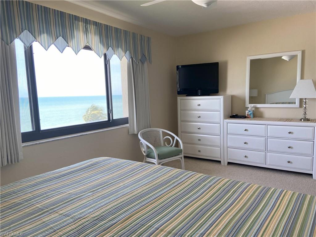 Bedroom featuring light colored carpet