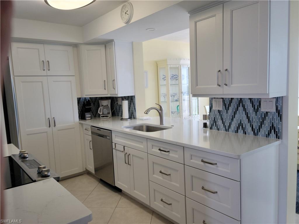 A central galley kitchen with plenty of cabinets and all you need for a carefree vacation.