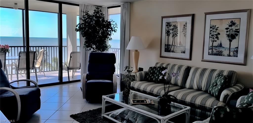 Living room with gulf views and screened lanai