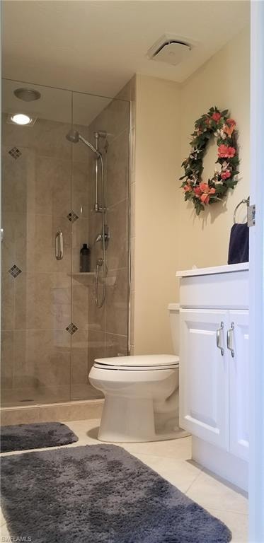 Guest bath with tiled shower, glass door and spacious vanity.