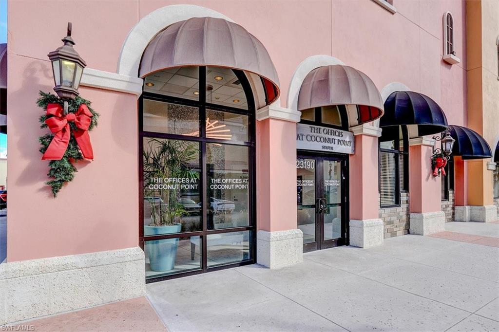South Building entrance with double glass doors and awnings