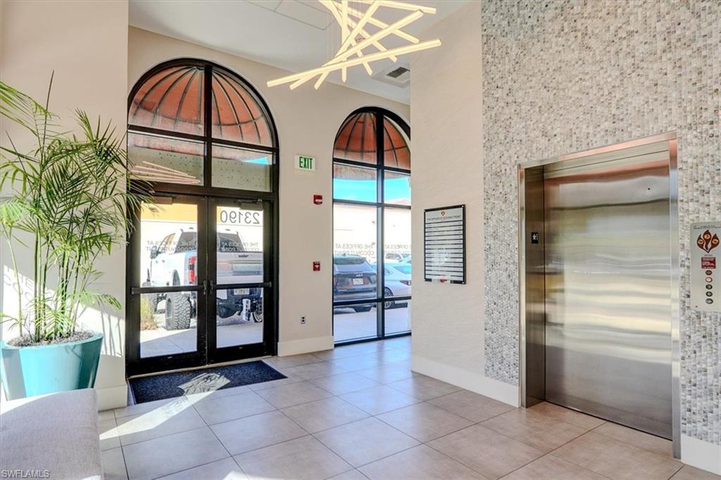South Entrance lobby to elevator & mailboxes with a high ceiling