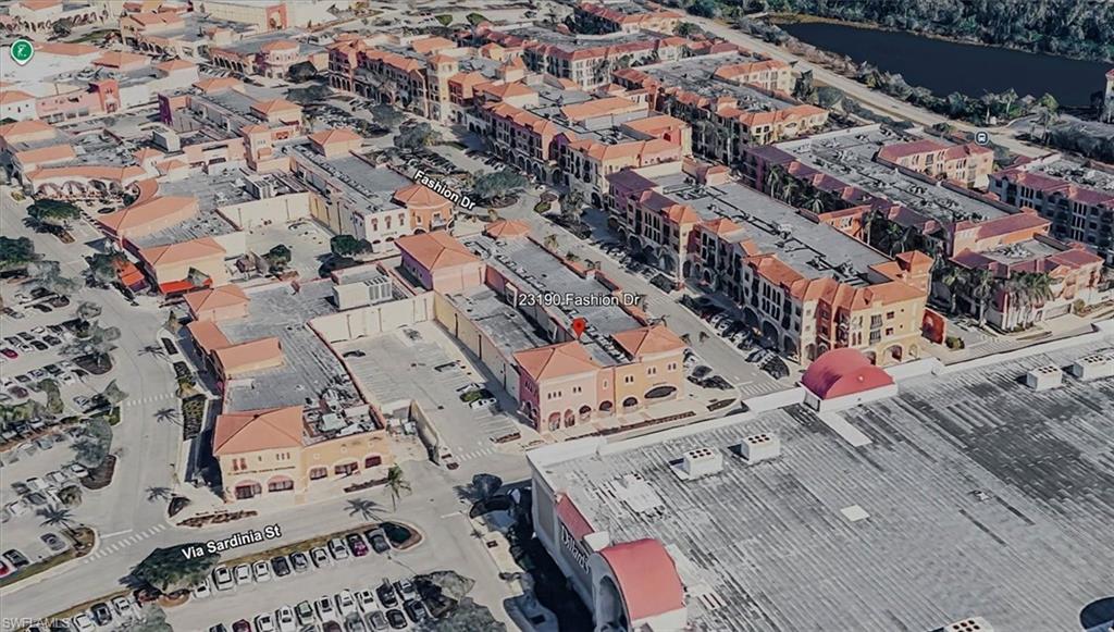 View of property location with nearby urban area