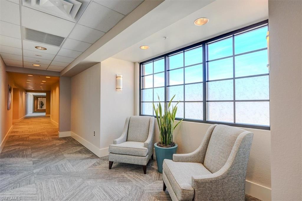 Sitting room with recessed lighting and a drop ceiling in common area corridor hallway 2nd floor