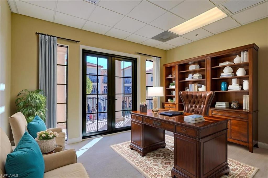 Office sample layout &  area featuring french doors and a drop ceiling