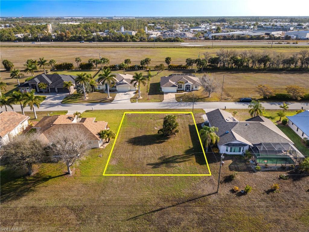 Aerial perspective of suburban area featuring property parcel outlined