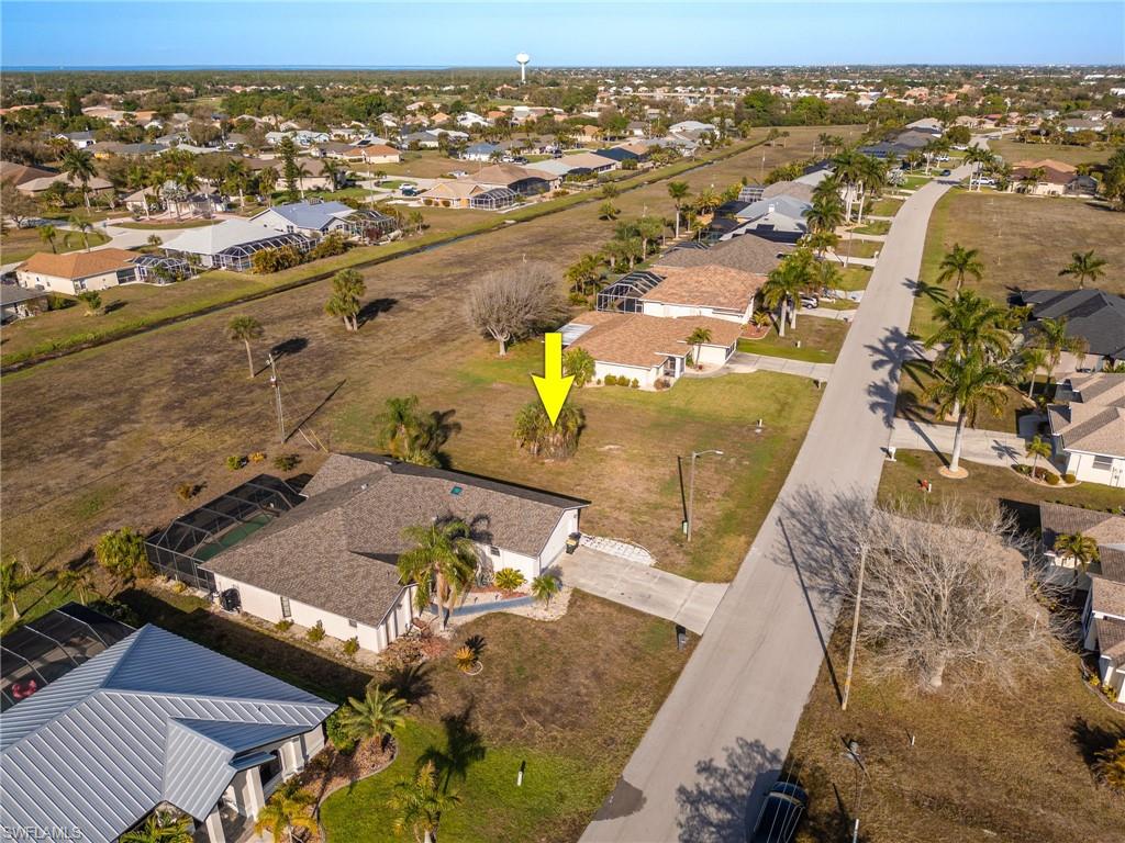 Aerial overview of property's location featuring nearby suburban area